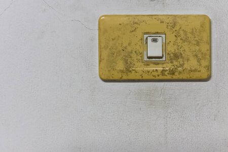 white breaker and lighting switch at wallの写真素材