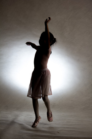 Silhouette of a little girl in balletの写真素材