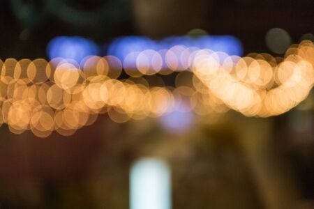 Defocused abstract texture bokeh background on night city lighting