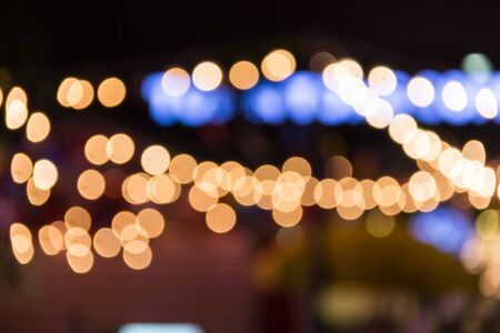 Defocused abstract texture bokeh background on night city lightingの写真素材