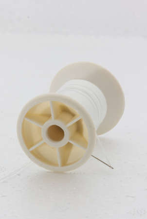 White Bobbin Sewing on white  backgroundrepairの写真素材