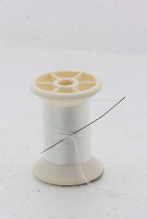 White Bobbin Sewing on white  backgroundrepair