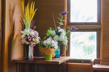 bouquet in jar decoration on wood wall in houseの写真素材