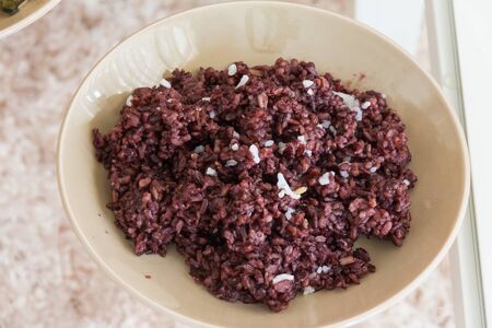delicious rice berry on brown dishの写真素材