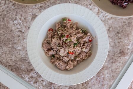 delicious fresh tuna mixed Thai food on white bowlの写真素材