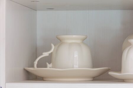 coffee cup on shelf in home