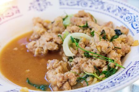 Stir fried with squid and vegetable on dishの写真素材