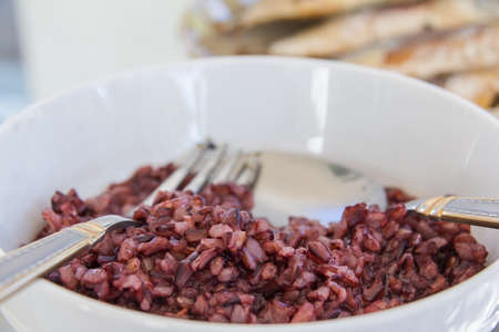 hot rice-burry with other food on glass table 