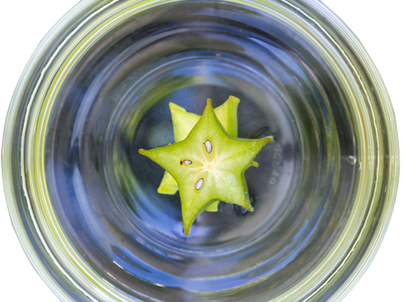 star apple in bowl isolated on white backgroundの写真素材