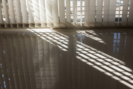 Sunlight through door curtain at homeの写真素材