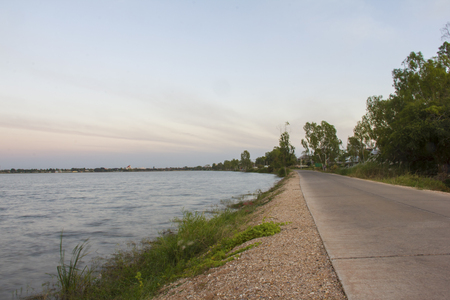 concrete street view with big lake at evening timeの写真素材