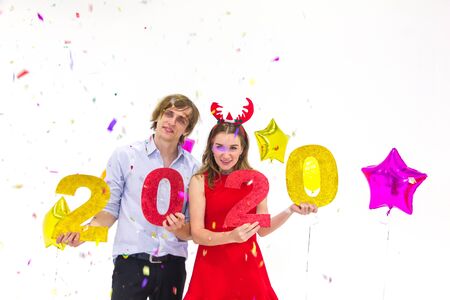 Cute Caucasian couple celebrate happy new year 2020 and Christmas day isolated with white background