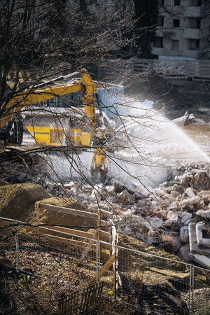 Urban Building Demolition Site. Residential Construction Site Behind Apartment Windows: View Through...