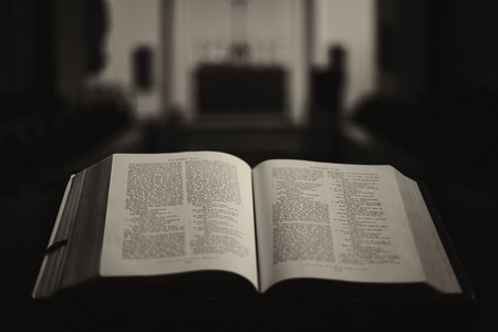 An open book which appears to be the Bible on the stand in the in-house church of St Stephen's House - theological college in Oxford.の写真素材