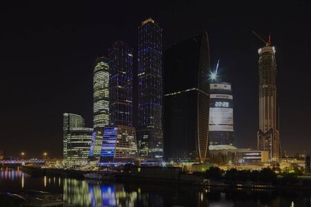 Skyscrapers of Moscow-city financial centre standing on the bank of Moskva-river in the middle of the night. Some of the buildings were still under construction.のeditorial素材