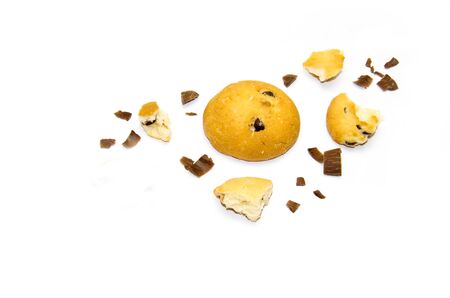 chocolate cookies and pieces of cookies and chocolate on a white background selectiveの写真素材