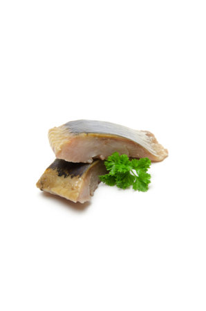 Herring fillet with parsley isolated on a white background.の写真素材