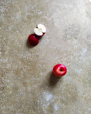 Red apple on a beige background. Top view photography.の写真素材