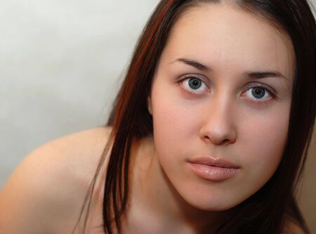 young girl with a long brunette hairの写真素材