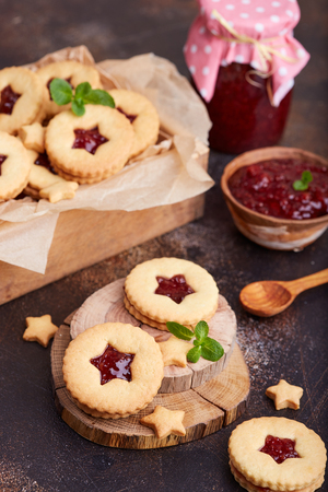 Linzer Christmas cookies with stars. Delicious biscuits with raspberry jam. Sweet dessert.の写真素材