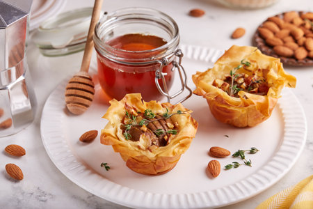 Rose shaped filo pastry cakes with apples, pears, honey  and almond nuts. Delicious autumn homemade...
