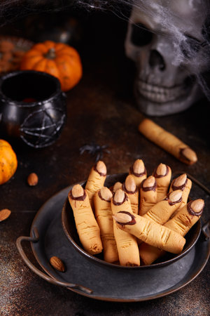 Halloween cookies witch`s fingers with chocolate and almond nuts. Delicious and scary dessert for treats.の写真素材