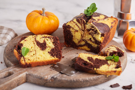Pound marble cake with chocolate and pumpkin layers. Delicious homemade dessert.の写真素材