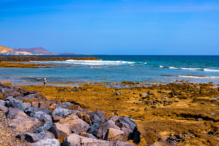 View of the Atlantic coast in Tenerife. Beach, volcanic stones, pebbles. Tenerifeの写真素材