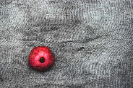 Ripe pomegranates on grey background, top view with space for text. Linen backgroundの写真素材