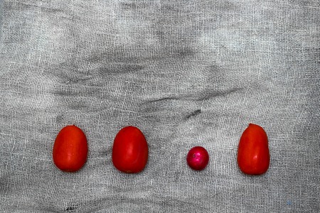 Vegetables on a gray background from flax. Tomato, yellow pepper, cucumber, lemon,radishの写真素材