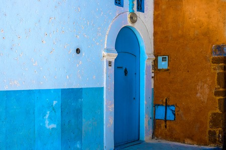 Blue-white traditional street beautiful traditional old door in Medina city Rabat, Morocco, Africaの写真素材