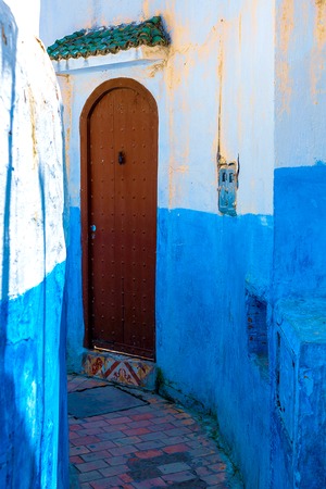 Blue-white traditional street beautiful traditional old door in Medina city Rabat, Morocco, Africa
