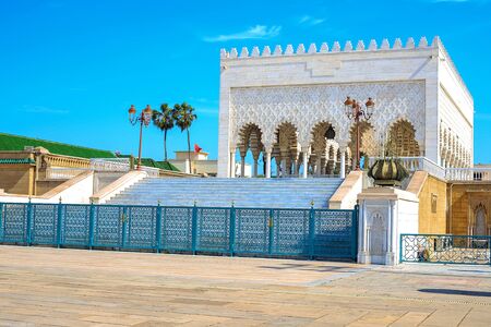 View of the snow-white Mausoleum of Mohammed V against the blue sky. Rabat, Moroccoの写真素材
