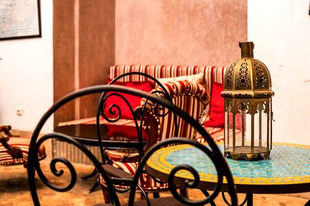 traditional arabic resting place, living room with original lamp, armchair and decoration