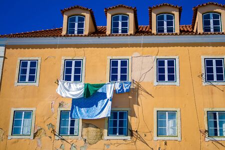 Minimalism, view of the building on which the linen is drying on the window, Lisbon, Portugal, February 2018の写真素材
