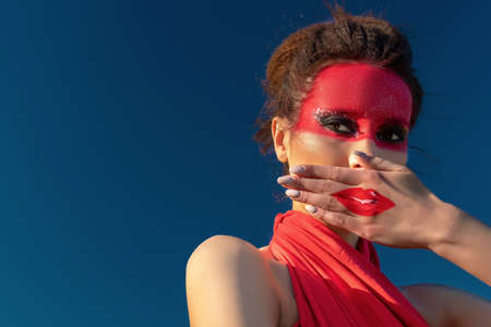 Portrait of a beautiful, brunette woman with creative makeupの写真素材