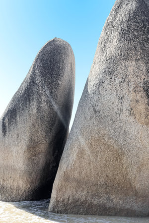 Huge rocks on the shore of the South China Sea in the Worlds End park. Sanya, Chinaの写真素材