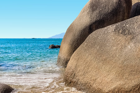 Huge rocks on the shore of the South China Sea in the Worlds End park. Sanya, Chinaの写真素材