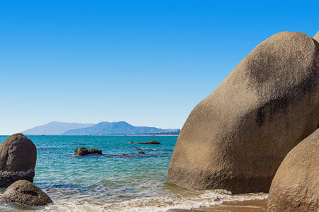 Huge rocks on the shore of the South China Sea in the Worlds End park. Sanya, Chinaの写真素材