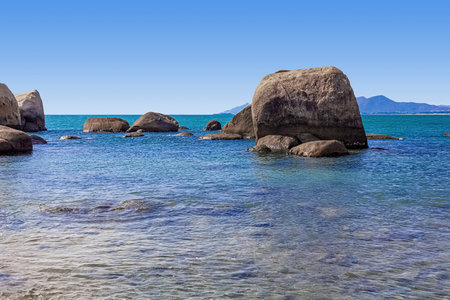 Huge rocks on the shore of the South China Sea in the Worlds End park. Sanya, Chinaの写真素材