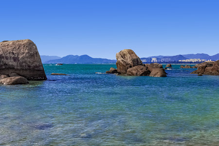 Huge rocks on the shore of the South China Sea in the Worlds End park. Sanya, Chinaの写真素材
