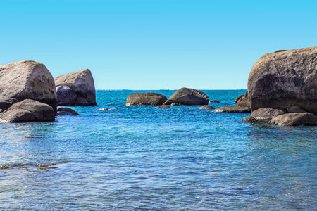 Huge rocks on the shore of the South China Sea in the Worlds End park. Sanya, Chinaの写真素材