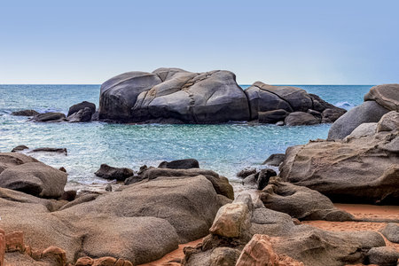 View of large rocks along the shore of the South China Sea. Sky Grottoes Park, Sanya, Chinaの写真素材