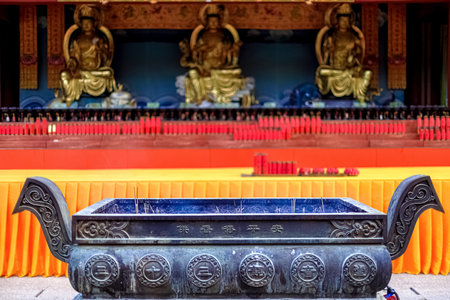 Hainan Island, Sanya: Nanshan Buddhist Center. View of the incense burner in front of the Templeの写真素材