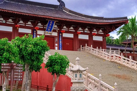 A traditional stone bridge with red lanterns in Nianshan Park, Sanya, Hainan, China.の写真素材