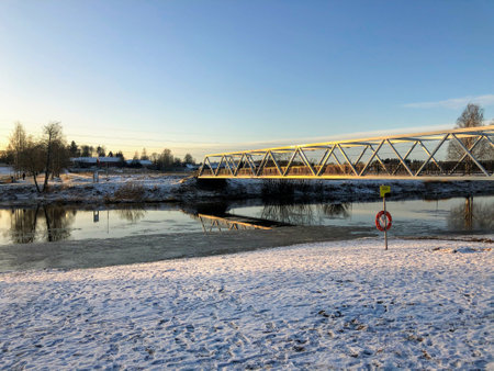 Landscape with the bridge over the river on a sunny winter dayの写真素材