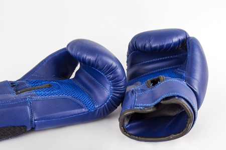 Boxing blue gloves on a white background. Fitness still life on a white background.の写真素材