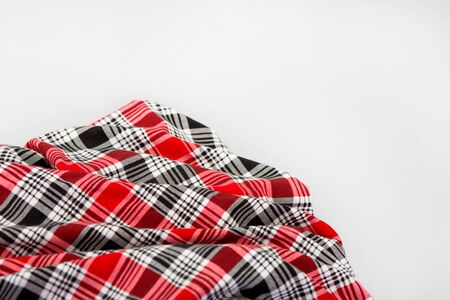 Red checkered fabric. Black and red checkered Scottish model. Textiles from plaid, tablecloths, clothes, shirts, dressesの写真素材