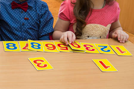 Math lesson in elementary school. Kids are playing. Educational games. A child in kindergarten....