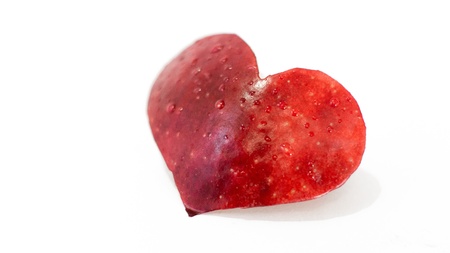 heart cut out of apples in dropsの写真素材